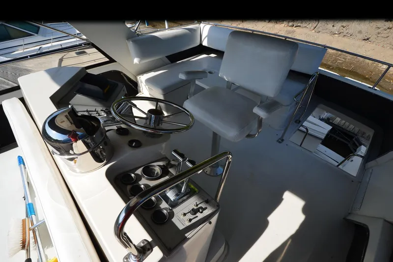 Slide: The Image of 1986 Carver Cockpit 4227 MY boat interior with steering wheel and captain's chair. - 24