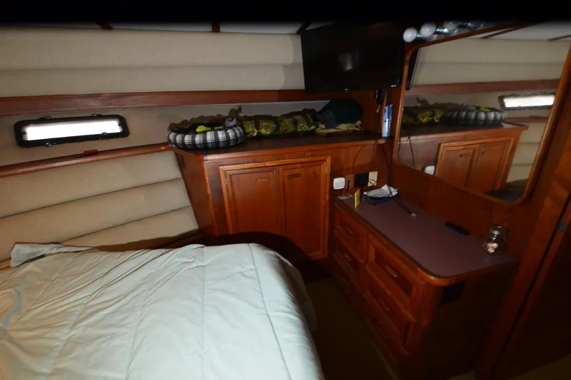 Slide: The Image of Interior of 1986 Carver Cockpit 4227 MY yacht with wood cabinetry and bed. - 41
