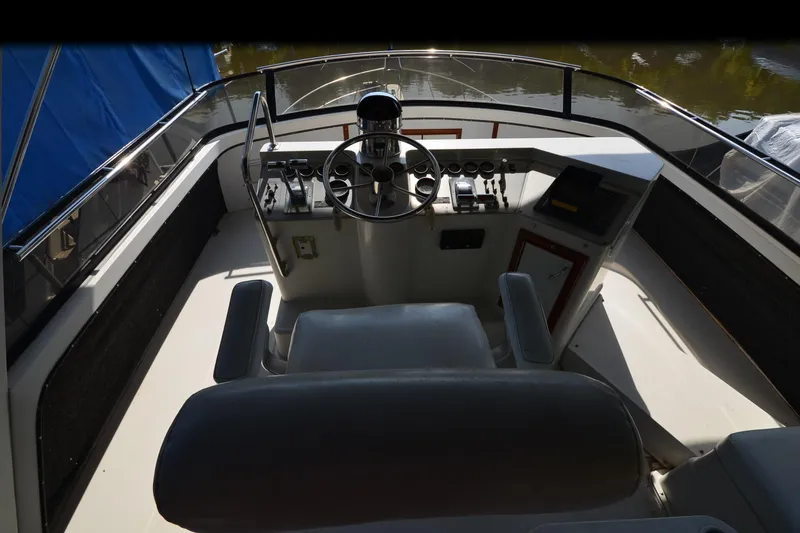 Slide: The Image of 1986 Carver Cockpit 4227 MY boat helm with steering wheel and control panel. - 50