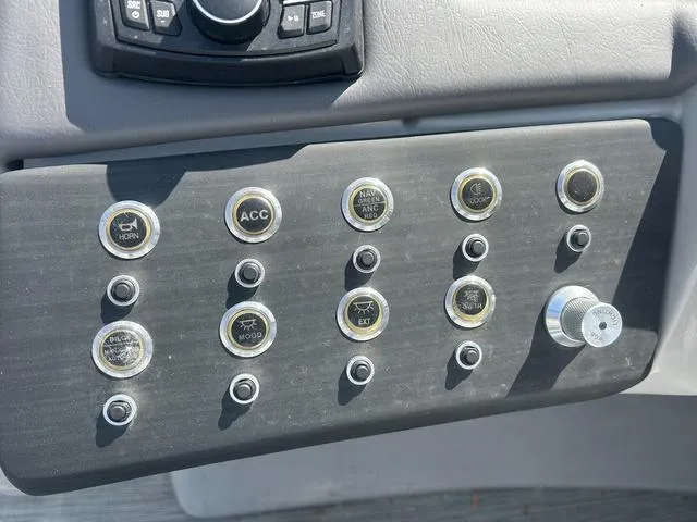 Slide: The Image of Control panel of 2023 Bennington 25 RFBWA Tritoon with labeled buttons and switches. - 12