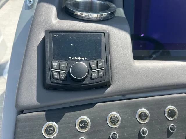 Slide: The Image of Control panel of 2023 Bennington 25 RFBWA Tritoon with Rockford Fosgate audio system. - 13