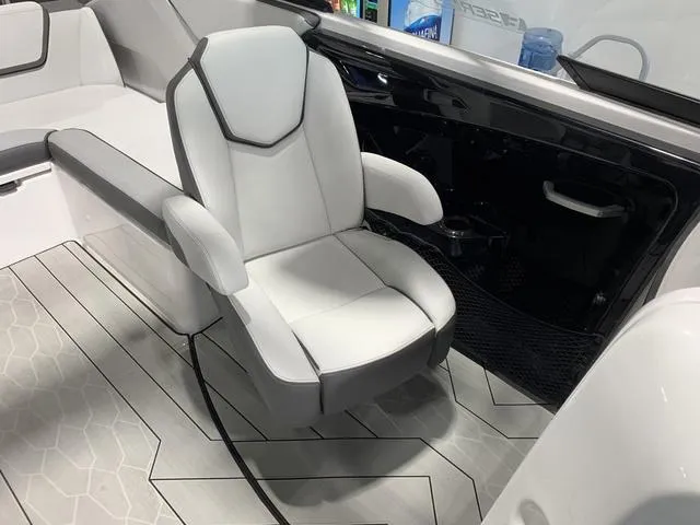 Slide: The Image of 2023 Yamaha Boats 252XE interior with sleek white seating and modern design. - 11