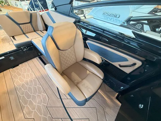 Slide: The Image of 2025 Yamaha Boats 255XD interior with beige seating and modern design. - 17