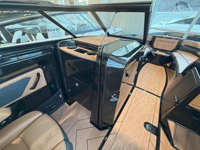 Slide: The Image of Interior of 2025 Yamaha Boats 255XD, featuring sleek design and luxurious seating. - 18