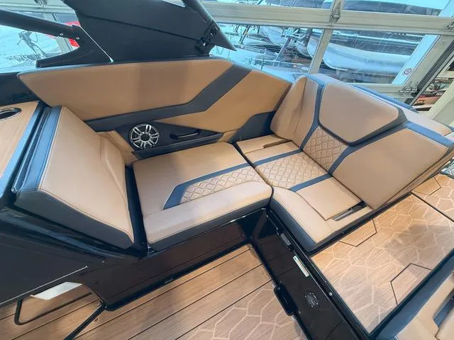 Slide: The Image of 2025 Yamaha Boats 255XD interior with luxurious tan seating and modern design. - 9