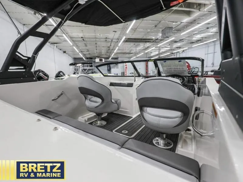 Slide: The Image of 2024 VR Series VR4 boat interior with modern seating at Bretz RV & Marine showroom. - 10