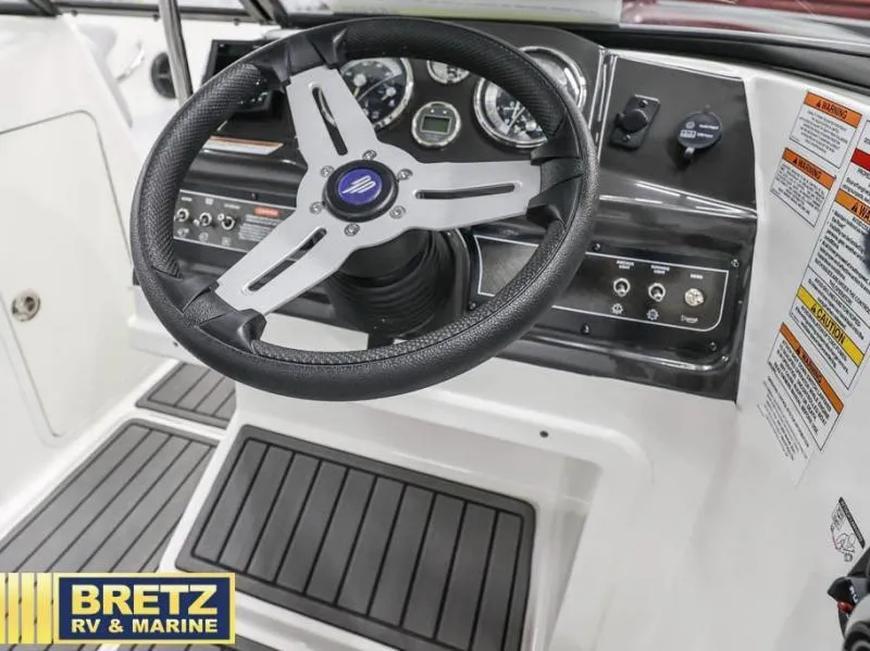 Slide: The Image of 2024 VR Series VR4 boat dashboard with steering wheel and control panel. - 11