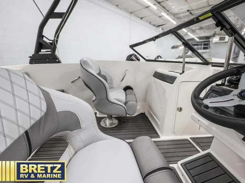 Slide: The Image of Interior of 2024 VR Series VR4 boat with modern seating and steering wheel. - 12