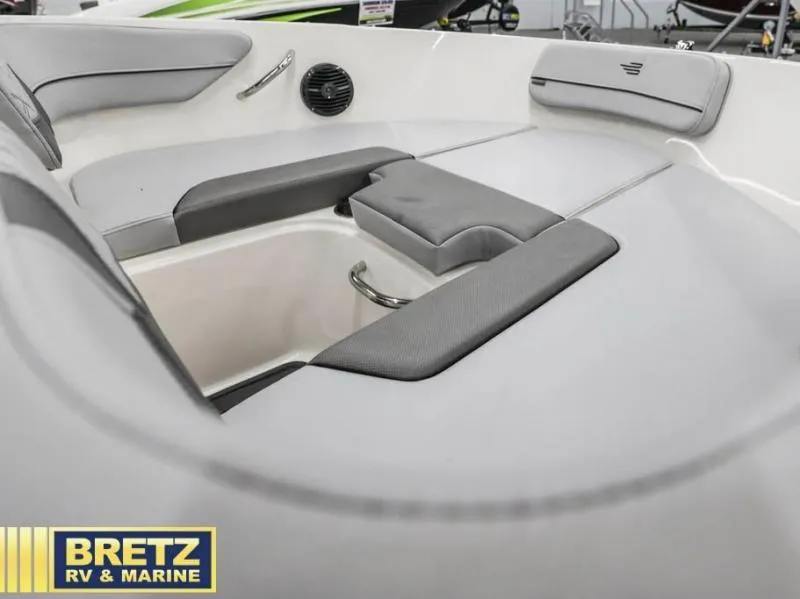 Slide: The Image of 2024 VR Series VR4 boat interior with gray seating and storage compartment. - 14