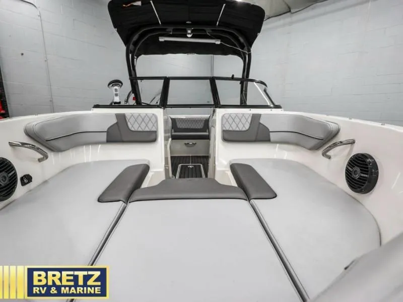 Slide: The Image of 2024 VR Series VR4 boat interior with gray seating, black canopy, and Bretz RV & Marine logo. - 15