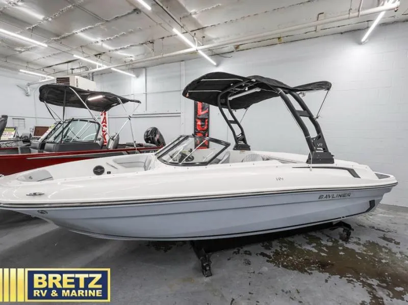 Slide: The Image of 2024 VR Series VR4 boat displayed indoors at Bretz RV & Marine showroom. - 5