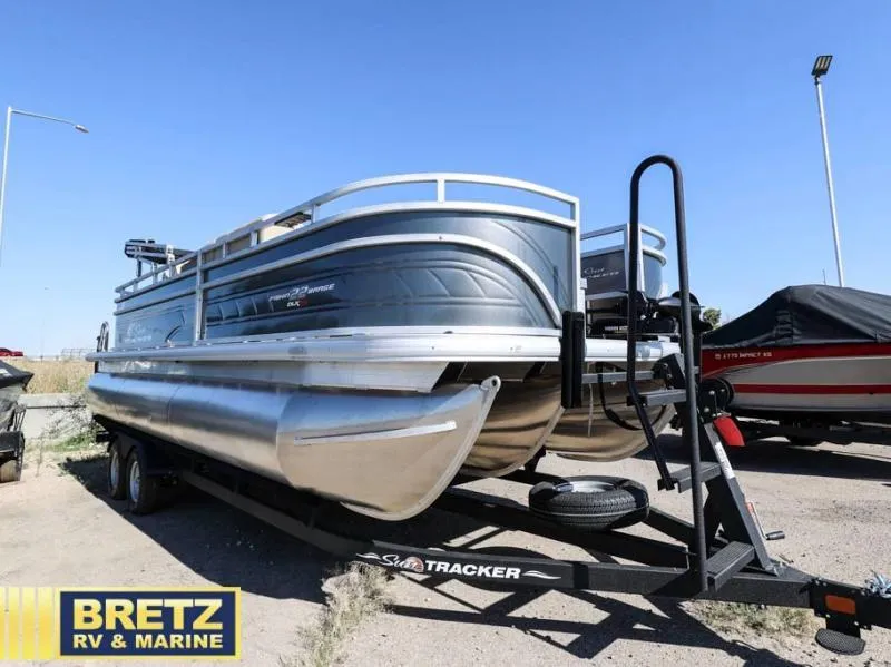 Slide: The Image of 2024 Fishin' Barge 22 XP3 pontoon boat on trailer at Bretz RV & Marine. - 1