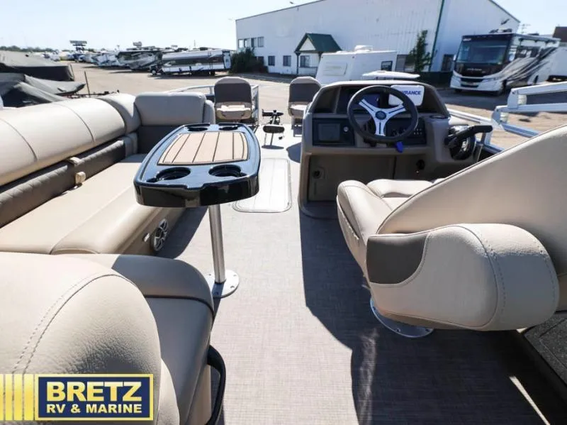 Slide: The Image of 2024 Fishin' Barge 22 XP3 interior with seating and steering wheel at Bretz RV & Marine. - 16