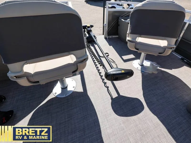 Slide: The Image of 2024 Fishin' Barge 22 XP3 interior with seating and trolling motor, Bretz RV & Marine. - 17