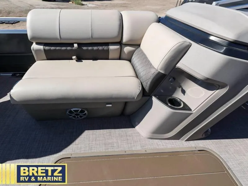 Slide: The Image of 2024 Fishin' Barge 22 XP3 boat interior seating with cup holder and speaker. - 18