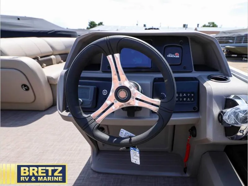 Slide: The Image of 2024 Sportfish 22 DLX boat dashboard with steering wheel at Bretz RV & Marine. - 10