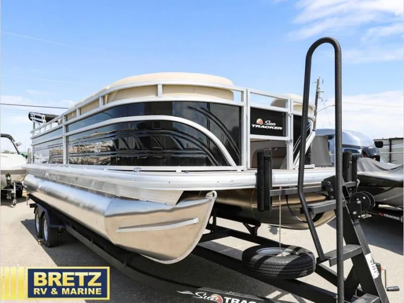 Slide: The Image of 2024 Sportfish 22 DLX pontoon boat on trailer at Bretz RV & Marine dealership. - 3