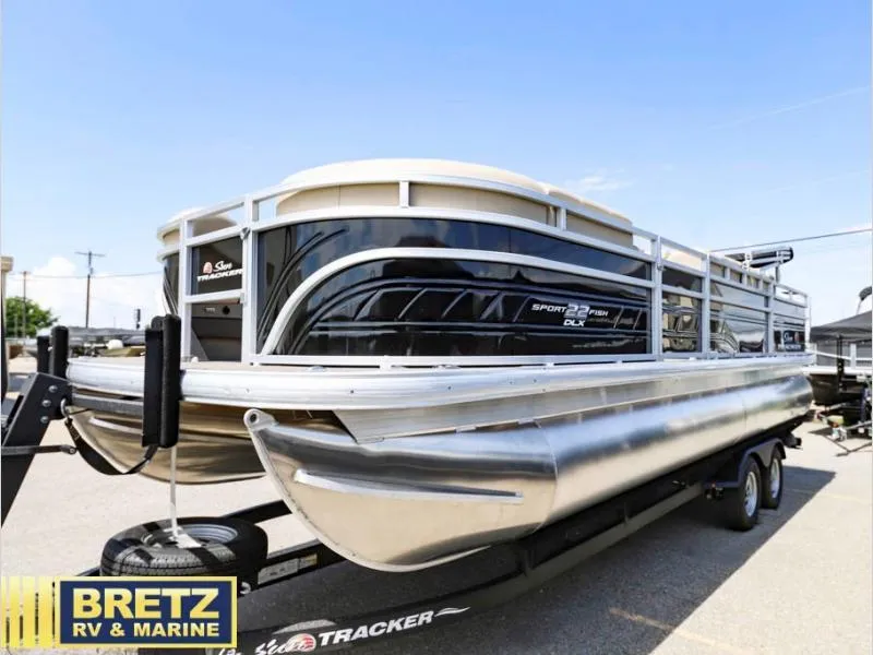 Slide: The Image of 2024 Sportfish 22 DLX pontoon boat on trailer at Bretz RV & Marine dealership. - 4