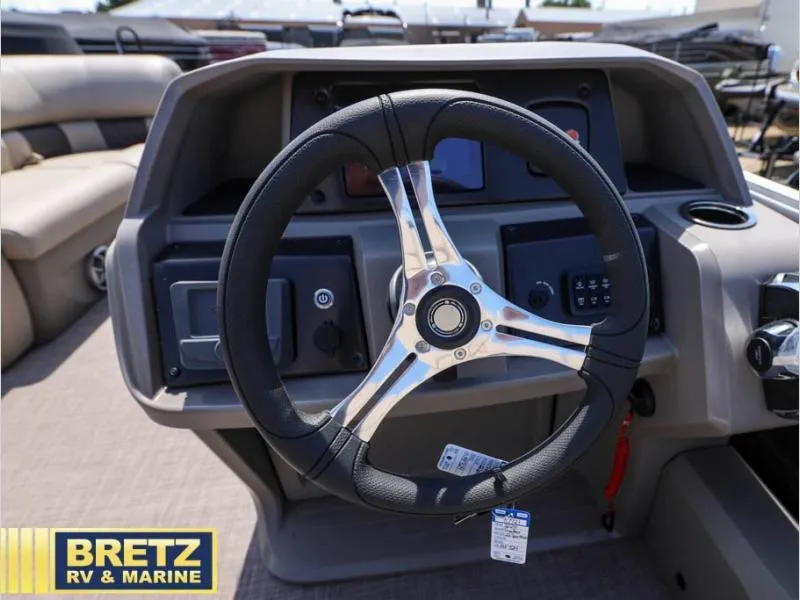 Slide: The Image of Steering wheel of 2024 Sportfish 22 DLX boat at Bretz RV & Marine. - 9