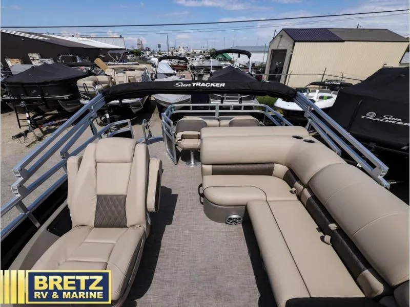 Slide: The Image of 2024 Sportfish 22 DLX pontoon boat with beige seating at Bretz RV & Marine. - 13