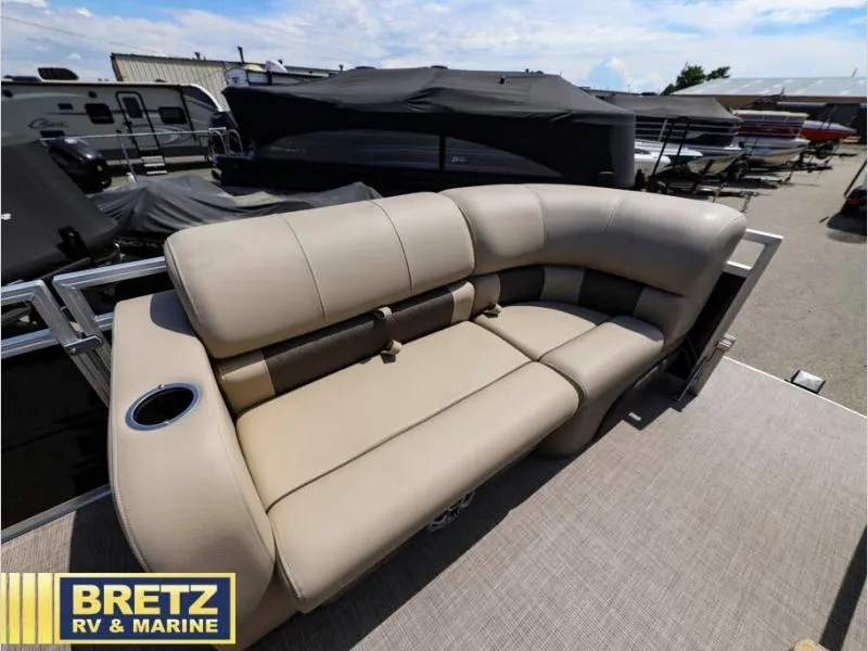 Slide: The Image of 2024 Sportfish 22 DLX boat seating area with beige upholstery at Bretz RV & Marine. - 16