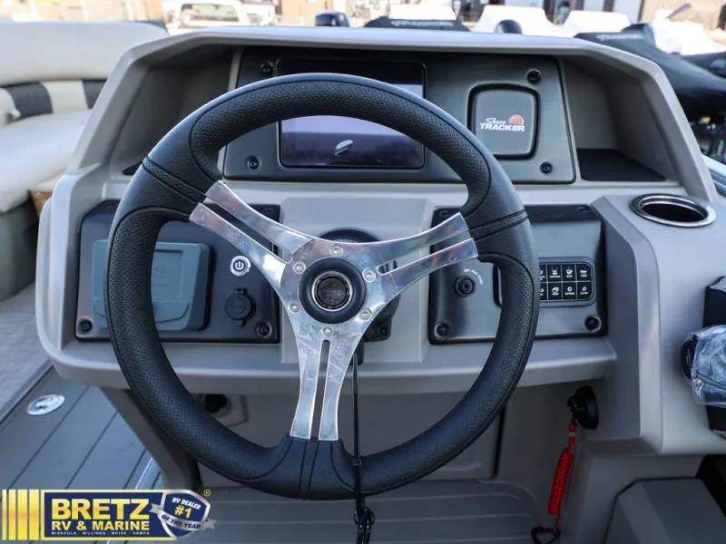 Slide: The Image of 2024 Sportfish 22 XP3 boat dashboard with steering wheel and control panel. - 15