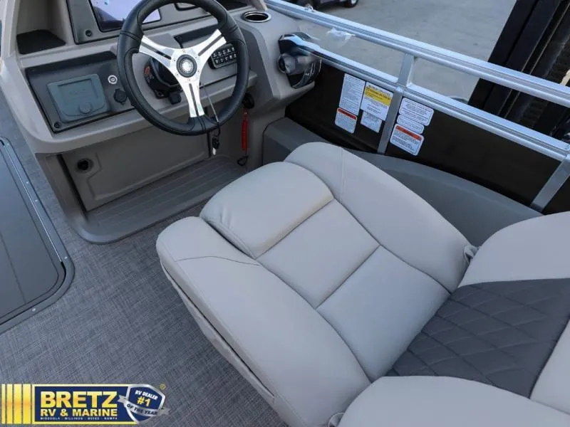 Slide: The Image of 2024 Sportfish 22 XP3 boat interior with steering wheel and captain's chair. - 17