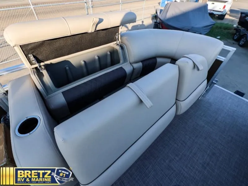 Slide: The Image of 2024 Sportfish 22 XP3 boat with open storage compartment and cushioned seating. - 26