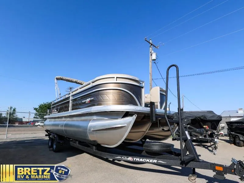 Slide: The Image of 2024 Sportfish 22 XP3 pontoon boat on trailer at Bretz RV & Marine dealership. - 5