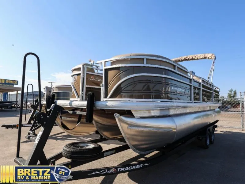 Slide: The Image of 2024 Sportfish 22 XP3 pontoon boat on trailer at Bretz RV & Marine dealership. - 8
