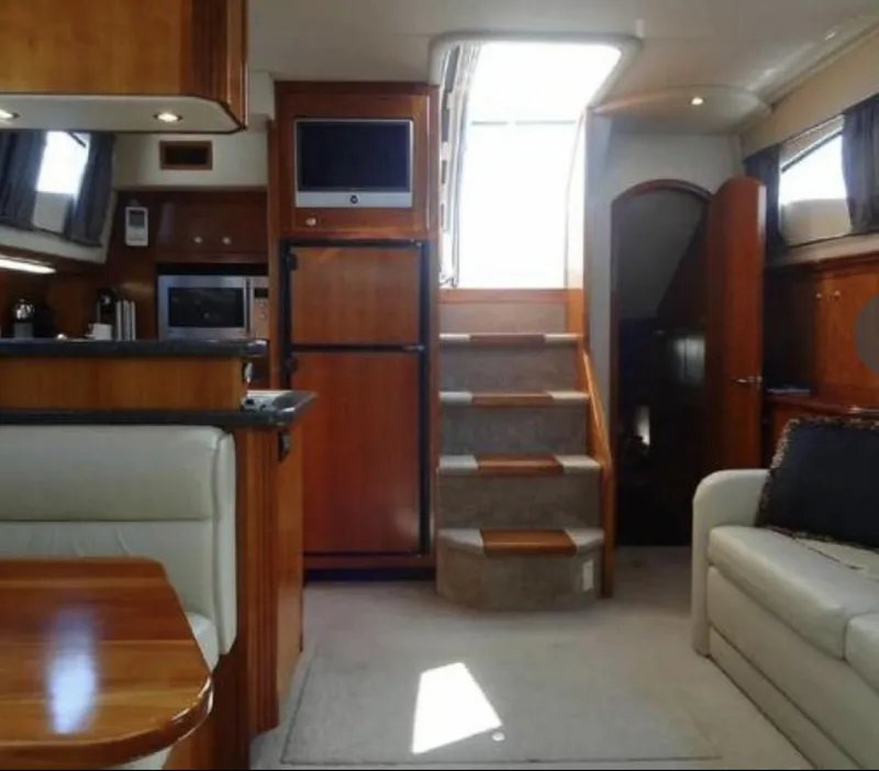 Slide: The Image of Luxurious interior of 2005 Cruisers Yachts 405 Express Motoryacht with wood finishes and modern amenities. - 10