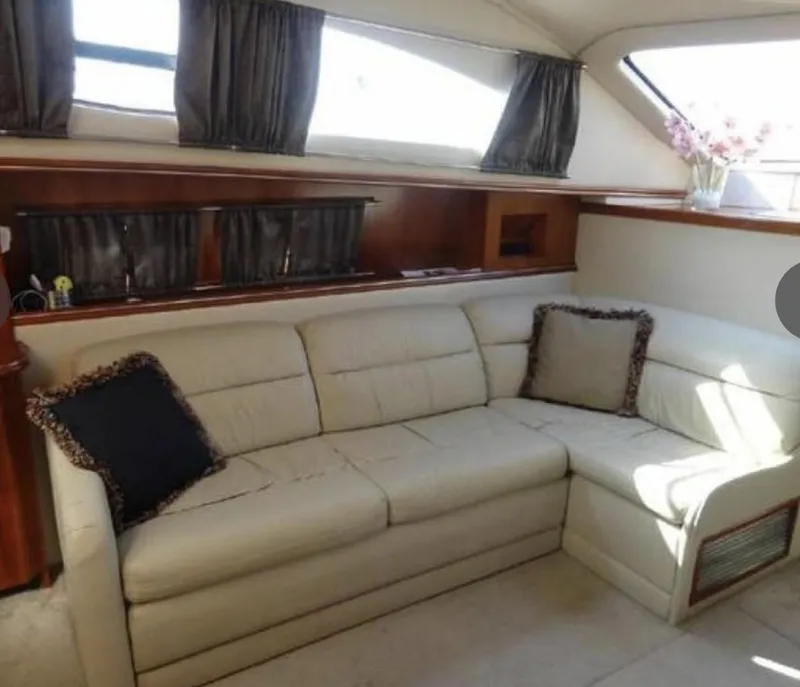 Slide: The Image of Luxurious interior of 2005 Cruisers Yachts 405 Express Motoryacht with beige sofa and elegant decor. - 11