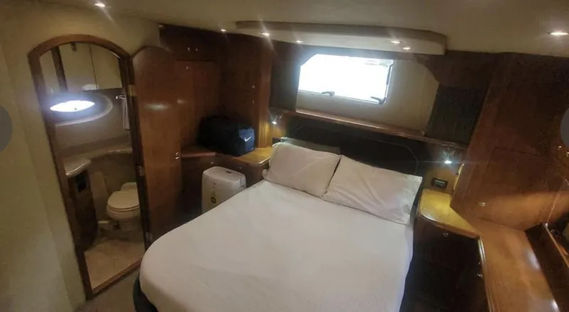 Slide: The Image of Luxurious cabin interior of 2005 Cruisers Yachts 405 Express Motoryacht with bed and ensuite bathroom. - 16