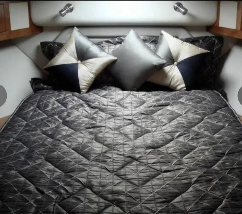 Slide: The Image of Luxurious bed in 2005 Cruisers Yachts 405 Express Motoryacht cabin with elegant pillows. - 18