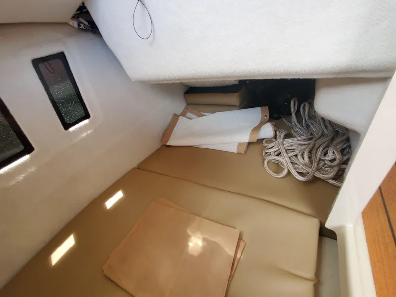 Slide: The Image of Cozy interior cabin of 2020 Ranger Tugs 25 with cushions and ropes. - 14