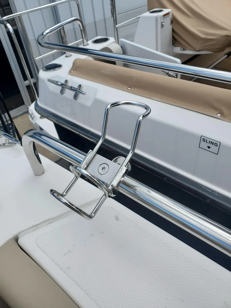 Slide: The Image of 2020 Ranger Tugs 25 boat with stainless steel railing and cup holder. - 20