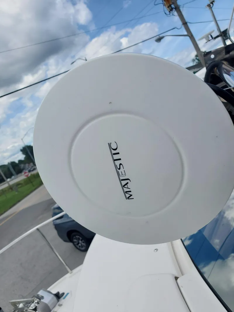 Slide: The Image of Radar dome on 2020 Ranger Tugs 25 boat under a cloudy sky. - 26