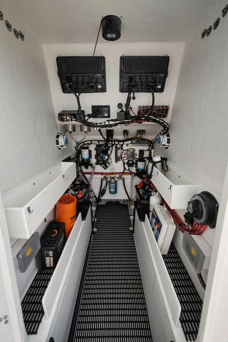 Slide: The Image of Interior of 2024 Rambo 27 boat showing electrical systems and wiring. - 10