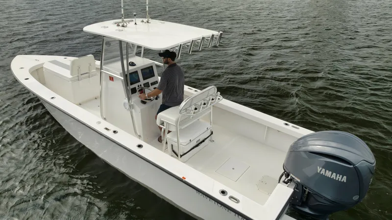 Slide: The Image of 2024 Rambo 27 boat with Yamaha engine on open water. - 21
