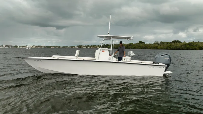 Slide: The Image of 2024 Rambo 27 boat on water under cloudy sky. - 24