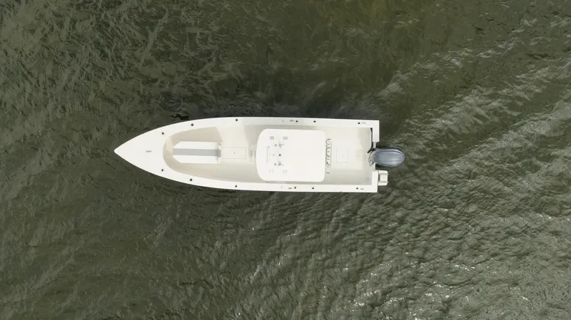 Slide: The Image of Aerial view of 2024 Rambo 27 boat on water. - 25
