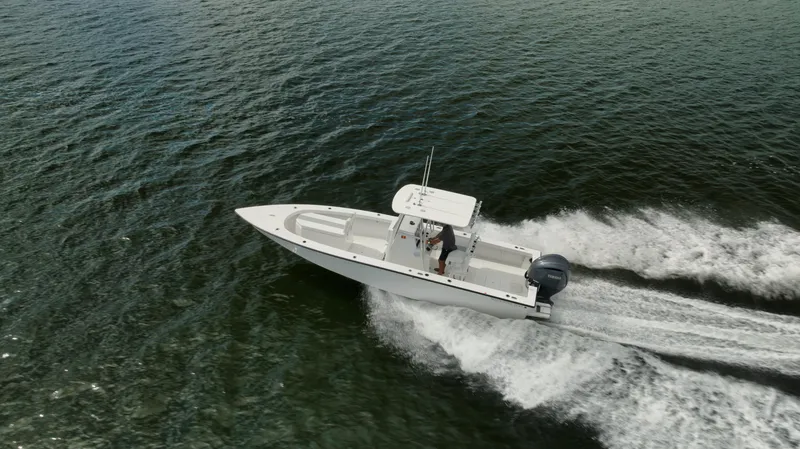 Slide: The Image of Aerial view of 2024 Rambo 27 boat speeding on open water. - 31