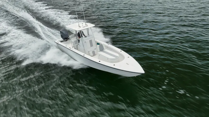 Slide: The Image of 2024 Rambo 27 boat cruising on open water, showcasing sleek design and performance. - 35