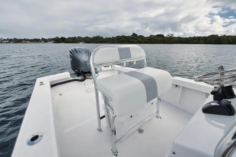 Slide: The Image of 2024 Rambo 27 boat on water, featuring sleek seating and modern design. - 5