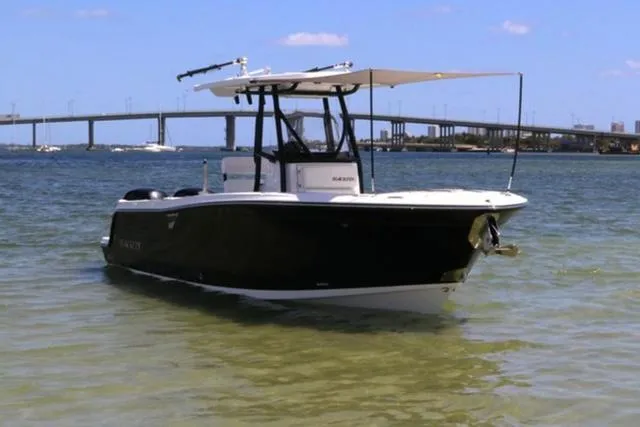 Slide: The Image of 2024 Blackfin 252CC boat in calm waters near a bridge. - 3