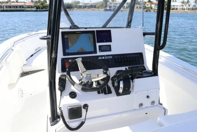 Slide: The Image of 2024 Blackfin 252CC boat dashboard with navigation system and controls. - 7