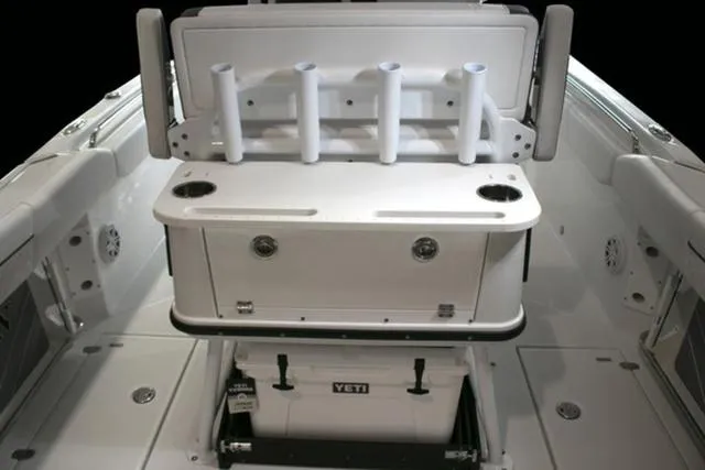 Slide: The Image of 2024 Blackfin 252CC boat interior with rod holders and Yeti cooler. - 9