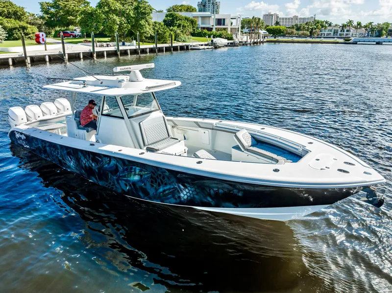 Slide: The Image of 2021 Yellowfin 39 boat on water, featuring sleek design and spacious seating. - 10