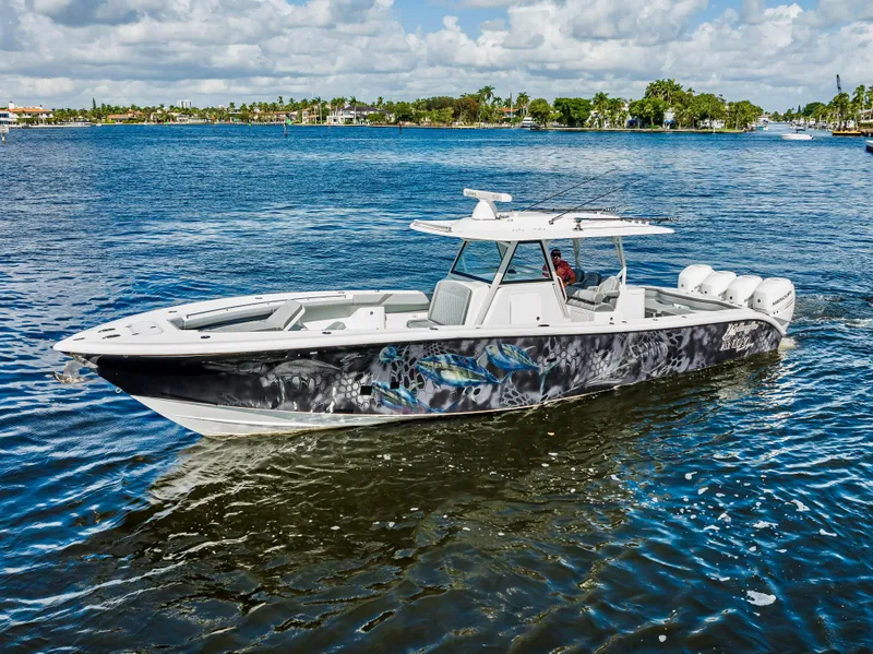 Slide: The Image of 2021 Yellowfin 39 boat cruising on a sunny day in calm waters. - 12