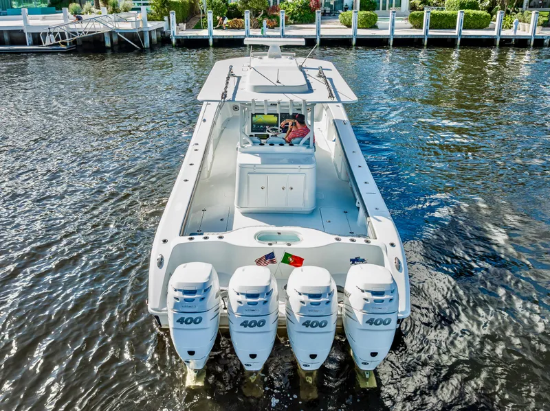 Slide: The Image of 2021 Yellowfin 39 boat with four 400 horsepower engines on the water. - 16